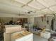 Spacious garage with abundant storage and work areas, featuring a ceiling fan at 123 Lakeview Dr, Auburndale, FL 33823