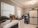Well-organized laundry area with washer, dryer, storage, and exterior access door at 123 Lakeview Dr, Auburndale, FL 33823