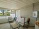 Relaxing screened patio with comfortable seating and a view of the yard at 123 Lakeview Dr, Auburndale, FL 33823