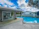 Enjoy the outdoors with a refreshing swimming pool and a covered patio with sliding glass doors at 123 Lakeview Dr, Auburndale, FL 33823
