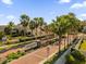 Greenville community entrance with palm trees and brick road at 1248 Ash Tree Cv, Casselberry, FL 32707