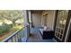 Charming balcony with seating, perfect for enjoying outdoor relaxation and fresh air at 14214 Fredricksburg Dr # 106, Orlando, FL 32837