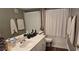 Bright bathroom features modern vanity, ample counter space and a shower-tub combo at 14214 Fredricksburg Dr # 106, Orlando, FL 32837