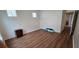 Spacious bedroom with wood floors and natural light, offering a blank canvas for personalization at 14214 Fredricksburg Dr # 106, Orlando, FL 32837
