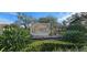 Community sign with lush landscaping at 14214 Fredricksburg Dr # 106, Orlando, FL 32837