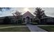 Beautiful home with manicured lawn and stone accents, showcasing curb appeal and inviting entrance at 14214 Fredricksburg Dr # 106, Orlando, FL 32837