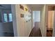 Hallway leads to bedroom and bathroom, decorated with unique license plate artwork at 14214 Fredricksburg Dr # 106, Orlando, FL 32837