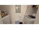 Functional laundry area featuring a modern washer, dryer, and ample storage solutions at 14214 Fredricksburg Dr # 106, Orlando, FL 32837