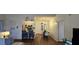 Bright and airy living room flows to the dining area, barstool seating, and modern decor at 14214 Fredricksburg Dr # 106, Orlando, FL 32837