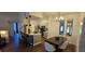 Open-concept living room featuring dining area, barstool seating, and modern light fixtures at 14214 Fredricksburg Dr # 106, Orlando, FL 32837