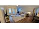 Bright living room boasts hardwood floors, modern furnishings, and sliding glass doors to the outdoor space at 14214 Fredricksburg Dr # 106, Orlando, FL 32837