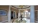 Elegant lobby area featuring tiled floors, decorative columns, and ample natural light at 14214 Fredricksburg Dr # 106, Orlando, FL 32837