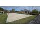 Sand volleyball court surrounded by lush green grass at 14214 Fredricksburg Dr # 106, Orlando, FL 32837