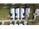 Aerial view of three houses with pools at 1432 Reunion Blvd, Reunion, FL 34747