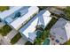 Aerial view of a community of houses with metal roofs, highlighting the neighborhood's architectural style at 1432 Reunion Blvd, Reunion, FL 34747
