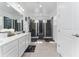 Elegant bathroom with double vanity, large shower, and view into bedroom at 1432 Reunion Blvd, Reunion, FL 34747
