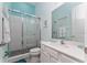 Clean bathroom with a shower/tub combo and white vanity at 1432 Reunion Blvd, Reunion, FL 34747
