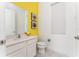 Clean bathroom with white vanity, toilet and shower at 1432 Reunion Blvd, Reunion, FL 34747