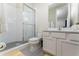Clean bathroom with a shower and white vanity at 1432 Reunion Blvd, Reunion, FL 34747