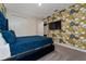 Blue velvet bed in bedroom with Versace wallpaper at 1432 Reunion Blvd, Reunion, FL 34747