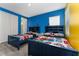 Blue bedroom with twin beds featuring Marvel bedding at 1432 Reunion Blvd, Reunion, FL 34747