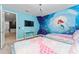 Charming bedroom with mermaid-themed mural and twin beds at 1432 Reunion Blvd, Reunion, FL 34747