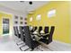 Bright dining room with modern chandelier and seating for eight at 1432 Reunion Blvd, Reunion, FL 34747