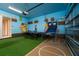 Game room has ping pong, basketball, and mural at 1432 Reunion Blvd, Reunion, FL 34747