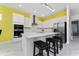 Modern kitchen with white cabinets, stainless steel appliances and quartz countertops at 1432 Reunion Blvd, Reunion, FL 34747