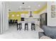 Modern kitchen with white cabinets, stainless steel appliances, and a large island with seating at 1432 Reunion Blvd, Reunion, FL 34747