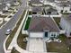 Aerial view of a single-Gathering home with a backyard and surrounding neighborhood at 1836 Delrose Rd, Kissimmee, FL 34744