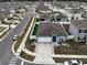 Aerial view of a single-Gathering home with a backyard and surrounding neighborhood at 1836 Delrose Rd, Kissimmee, FL 34744