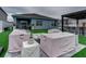 Relaxing backyard oasis with covered patio furniture at 1836 Delrose Rd, Kissimmee, FL 34744
