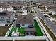 Spacious backyard oasis with artificial turf, pergola, and outdoor kitchen at 1836 Delrose Rd, Kissimmee, FL 34744