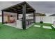 Outdoor kitchen with stainless steel appliances under a pergola at 1836 Delrose Rd, Kissimmee, FL 34744
