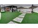 Outdoor kitchen and pergola with seating area in the backyard at 1836 Delrose Rd, Kissimmee, FL 34744