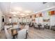 Community clubhouse with seating, tables, and hardwood floors at 1836 Delrose Rd, Kissimmee, FL 34744