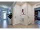 Well-lit entry hall with tile flooring and access to other rooms at 1836 Delrose Rd, Kissimmee, FL 34744
