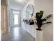 Modern entryway with tile flooring and large mirror at 1836 Delrose Rd, Kissimmee, FL 34744