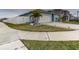 Neatly landscaped front yard with a white fence and concrete walkway at 1836 Delrose Rd, Kissimmee, FL 34744