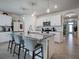 Modern kitchen with white cabinets, granite island, and stainless steel appliances at 1836 Delrose Rd, Kissimmee, FL 34744