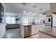 Open concept kitchen with stainless steel appliances and granite countertops at 1836 Delrose Rd, Kissimmee, FL 34744