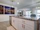 Modern kitchen island with granite countertop and stainless steel appliances at 1836 Delrose Rd, Kissimmee, FL 34744
