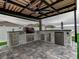 Outdoor kitchen with built-in grill and refrigerator at 1836 Delrose Rd, Kissimmee, FL 34744
