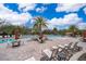 Community pool with lounge chairs and patio furniture at 1836 Delrose Rd, Kissimmee, FL 34744