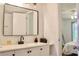 Modern bathroom with white vanity and a large mirror at 2035 Royal Bay Blvd # 45, Kissimmee, FL 34746