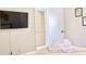 Bedroom with TV and comfortable bedding at 2035 Royal Bay Blvd # 45, Kissimmee, FL 34746
