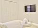 Bedroom with large closet and wall-mounted TV at 2035 Royal Bay Blvd # 45, Kissimmee, FL 34746