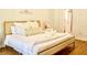 King-size bed, ample pillows and soft bedding in this well-lit bedroom at 2035 Royal Bay Blvd # 45, Kissimmee, FL 34746