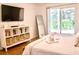 Bedroom with a king bed, TV, and access to a patio at 2035 Royal Bay Blvd # 45, Kissimmee, FL 34746